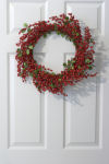 Berry wreath on white door