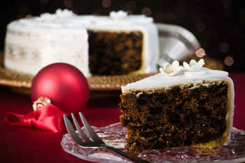 A slice of simply decorated traditional Christmas cake