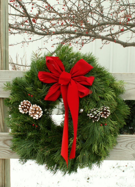 Christmas wreath on fence Christmas wreath on fence